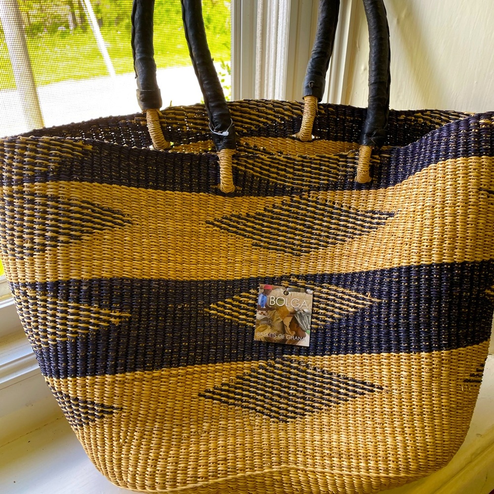 Gorgeous hand made straw bag. Made in Ghana.  Never used.  With tag.